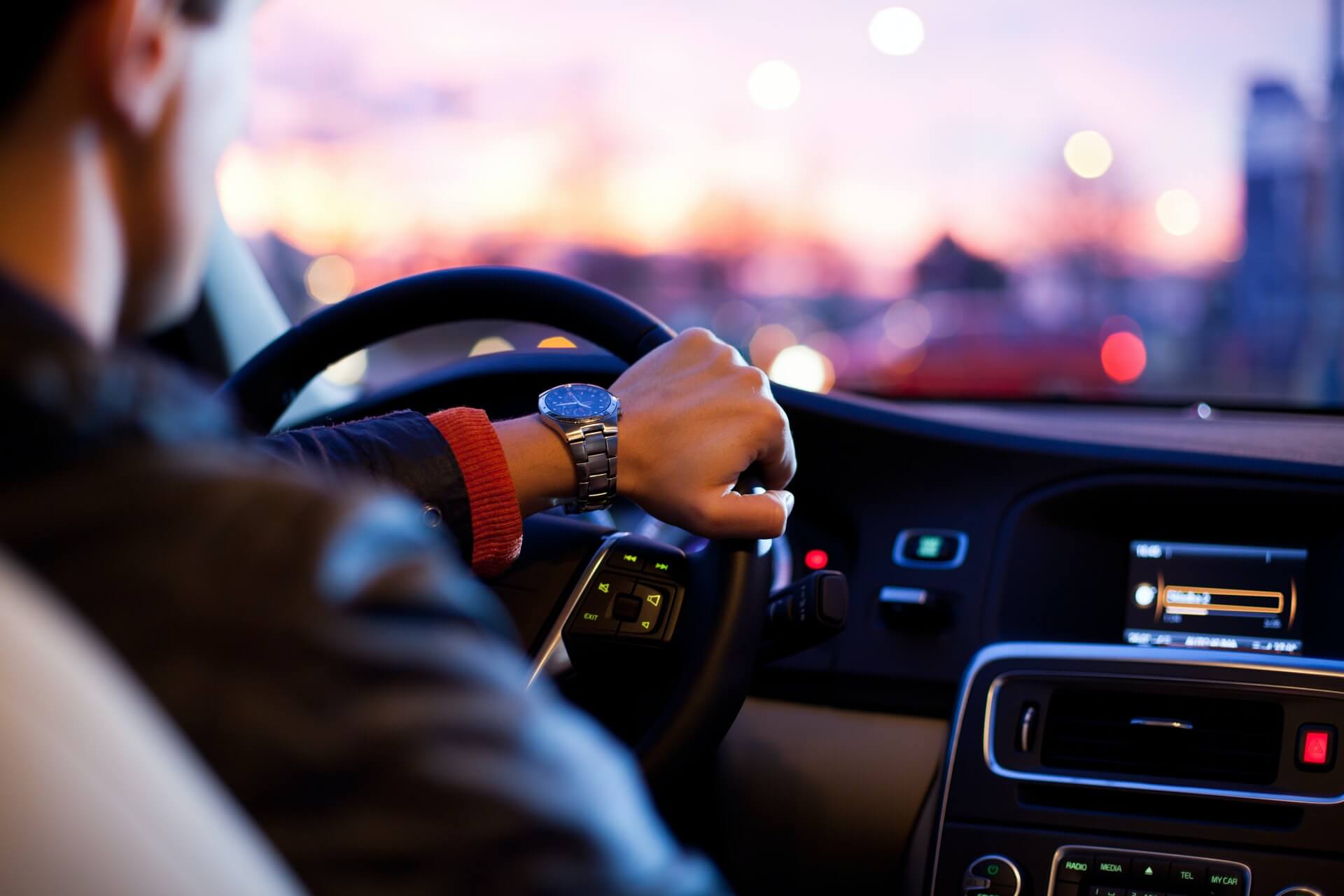 Driving Featured Man behind wheel of a car.