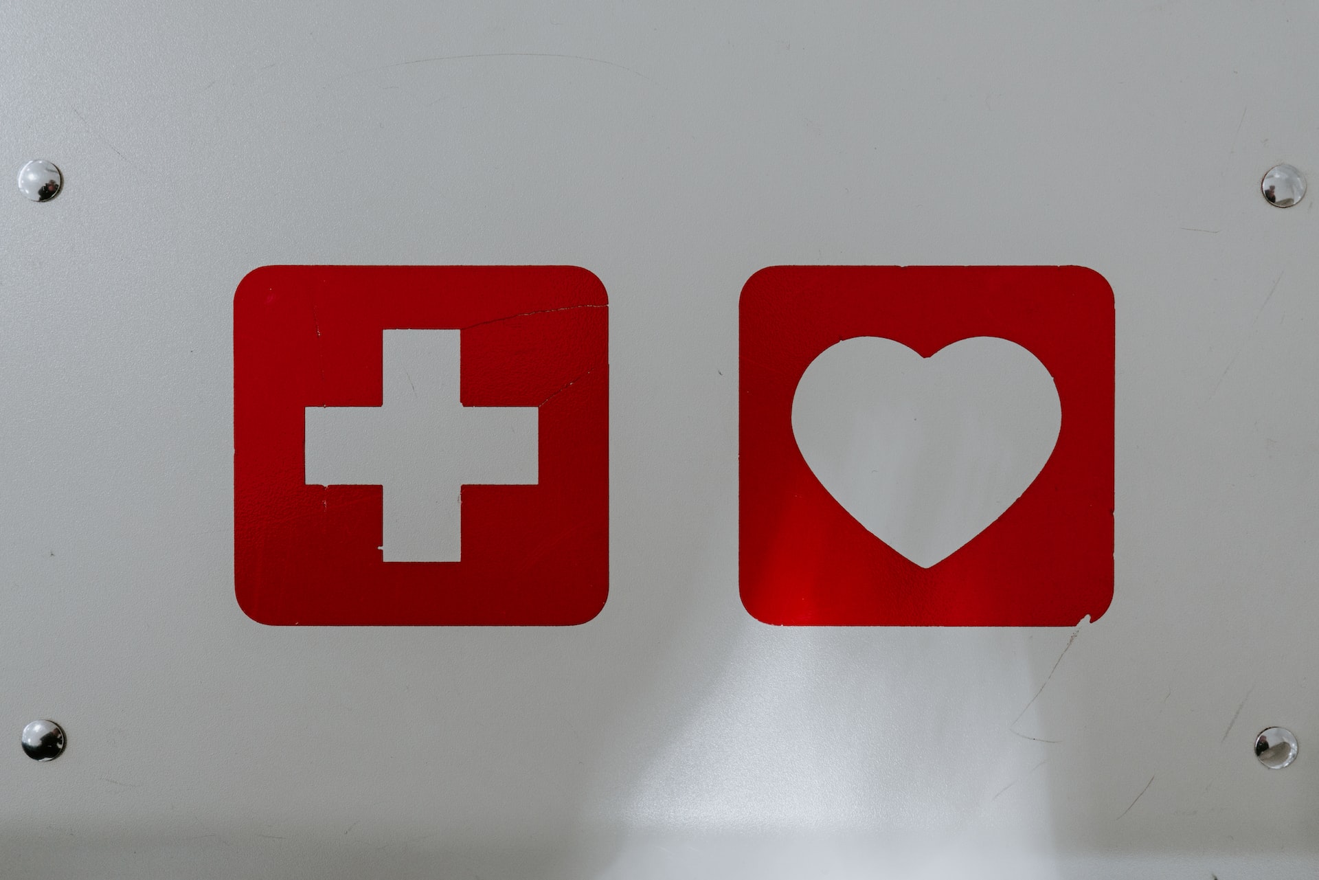 first aid tips White cross and white heart.